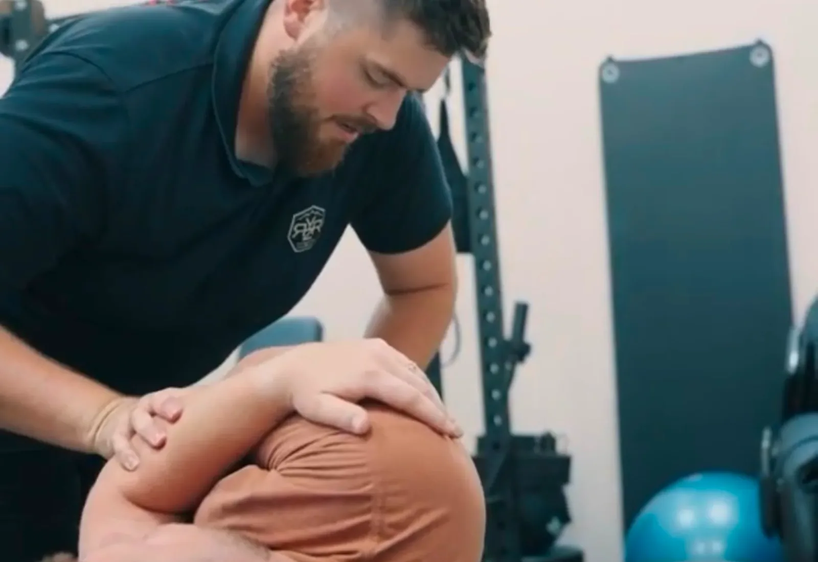 Dr. Trevor Anderson adjusting a patient at RYZR Rehab in North Logan